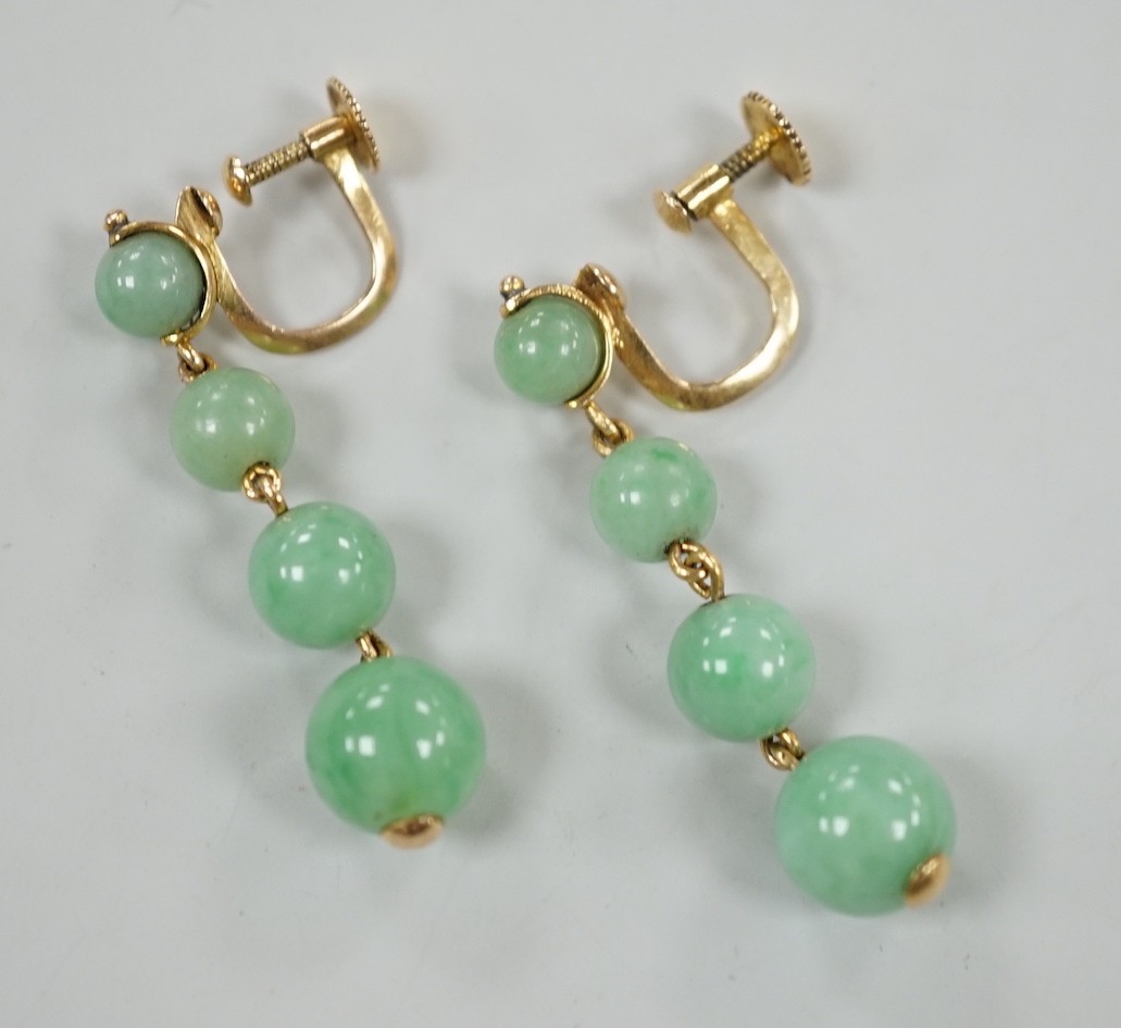A pair of yellow metal and graduated four stone jade bead drop earrings, 39mm, gross weight 6.6 grams.